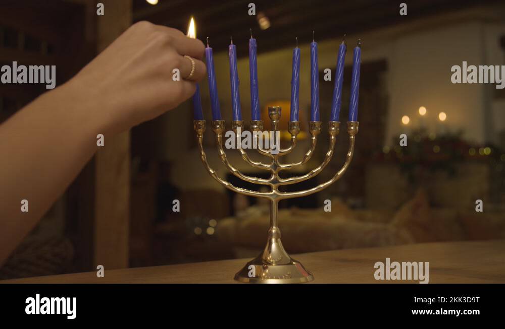 Shamash candle on menorah Stock Videos & Footage HD and 4K Video