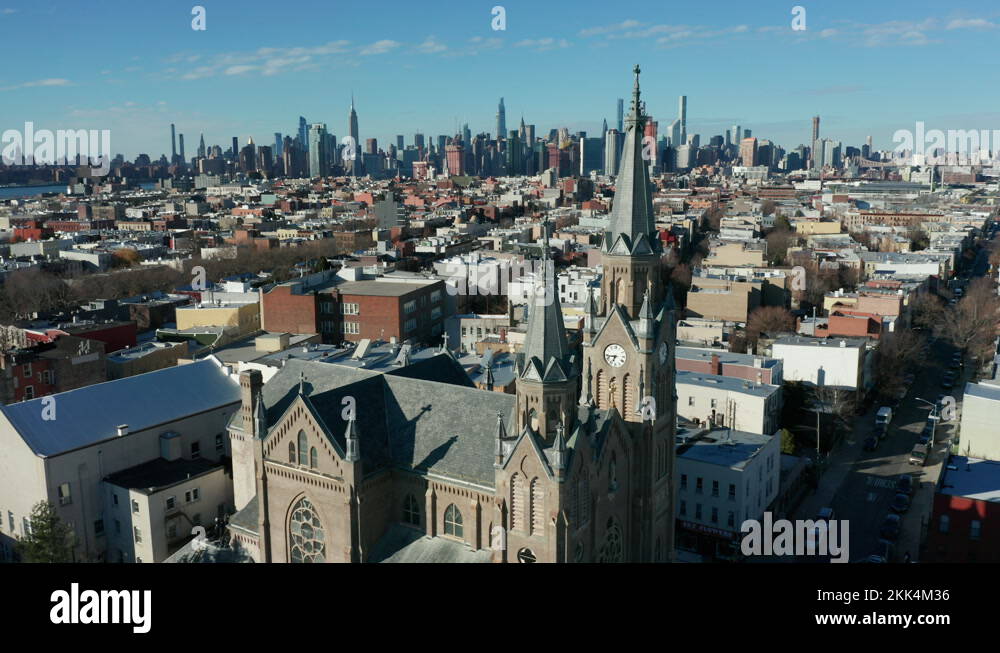 flying over Stanislaus Kostka church in Greenpoint towards view of NYC