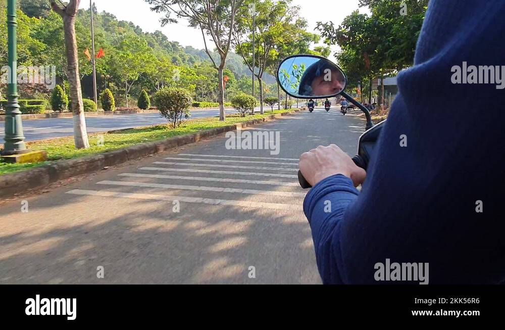 naked man riding bike