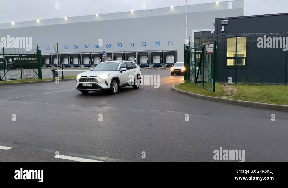 modern storage building, wide gates for trucks to load goods warehouse ...