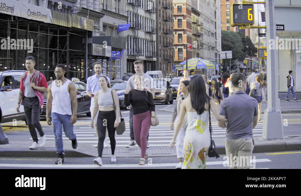 New York City street slow motion traffic lights zebra crossing young