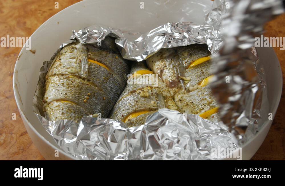 Baked fish in foil Stock Videos & Footage - HD and 4K Video Clips - Alamy