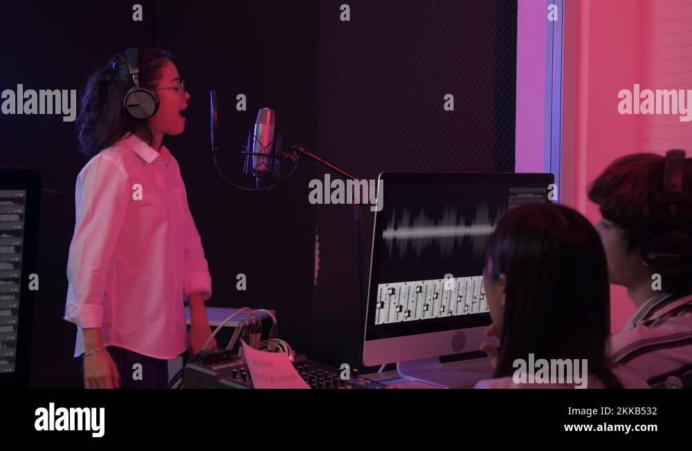 Audio recording concept of 4k Resolution. A young Asian singer is ...