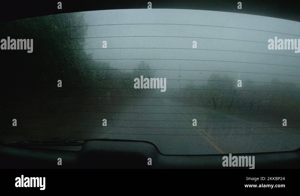 Foggy, wet, rear window of a moving vehicle. Captured in Hawaii, 4K ...