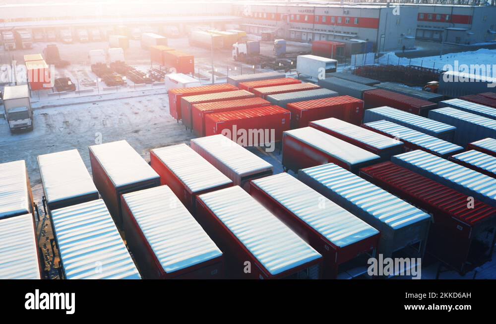 Cargo containers stand on the parking lot of the logistics terminal. Aerial view Stock Video