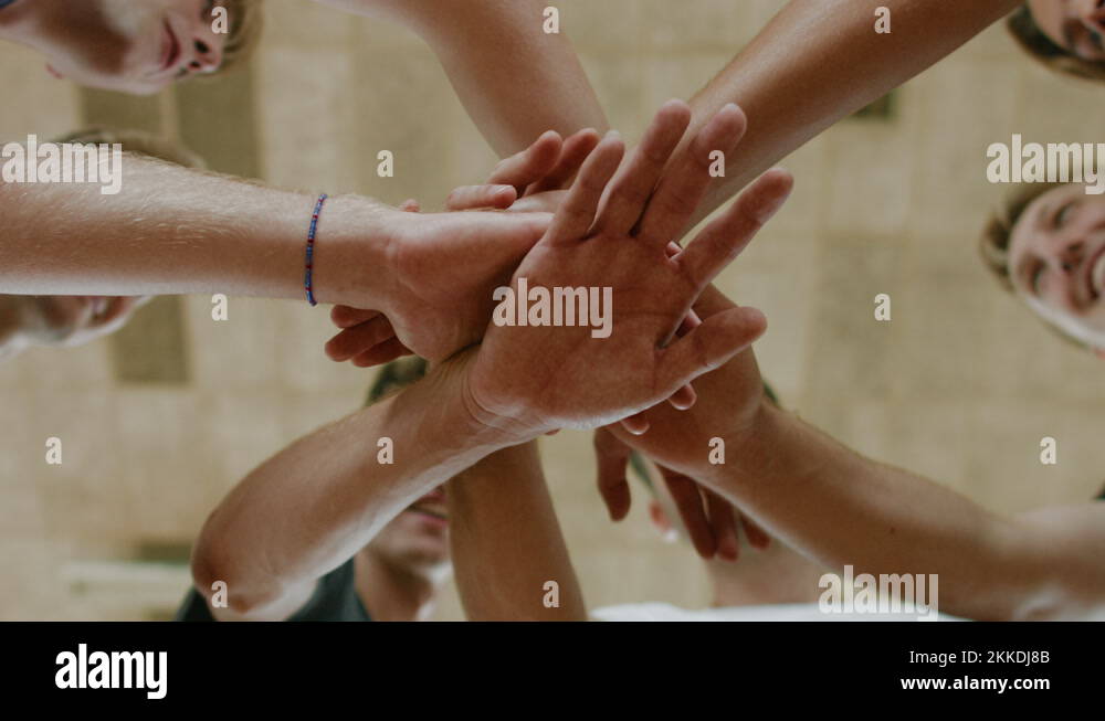 High team spirit of volleyball players hands together in circle close up shot Stock Video