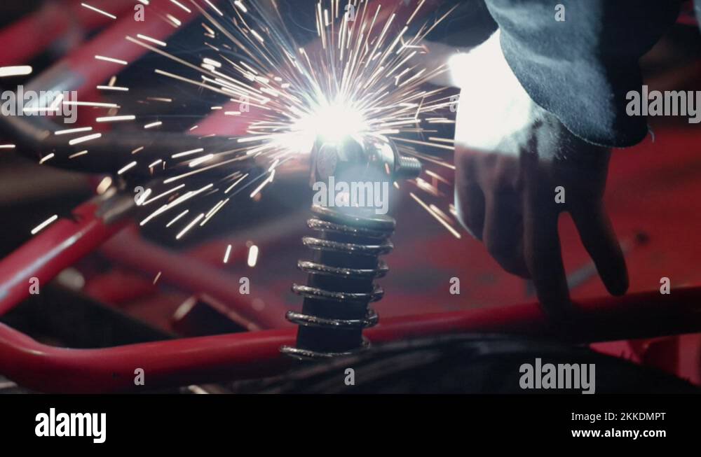 Bright light being cast from welding metal together on vehicle