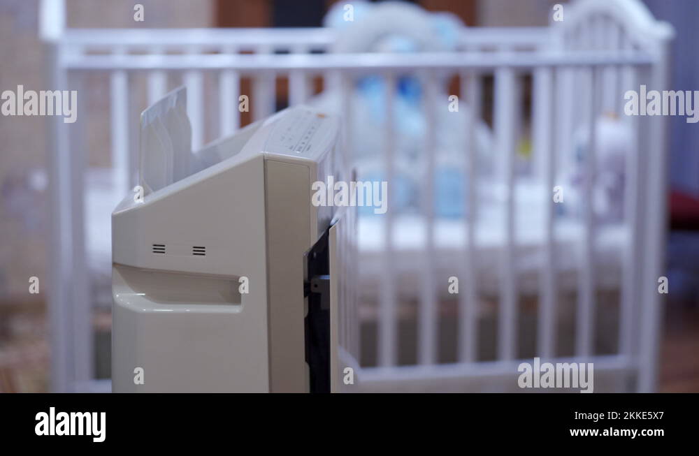 air purifier humidifier in bedroom, working humidifier in front of baby