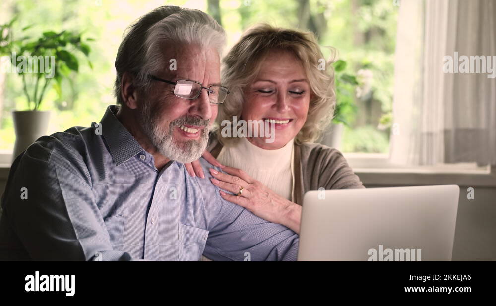 Happy Mature Older Couple Using Computer Applications Stock Video