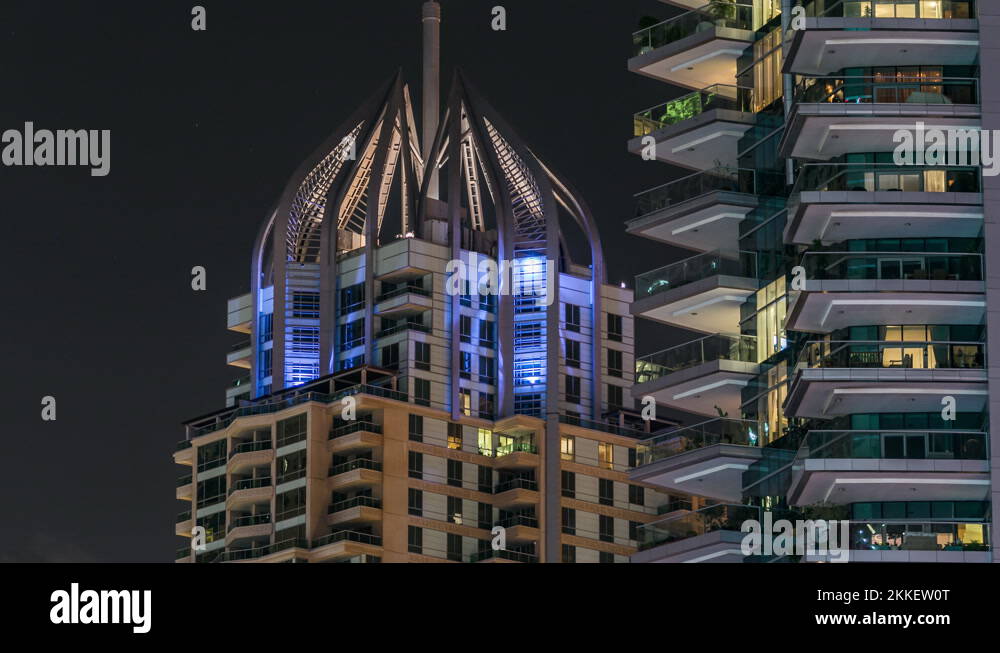 Close view of Dubai Marina tallest towers in Dubai at night timelapse