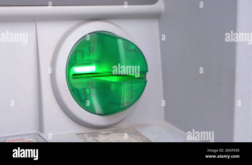 Green light flashes in the ATM card reader to indicate that it is ready