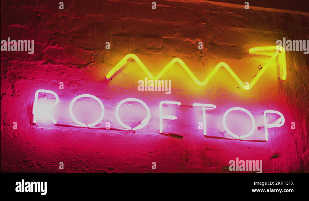 Neon sign saying Rooftop bar upstairs, nightlife, alcohol, and