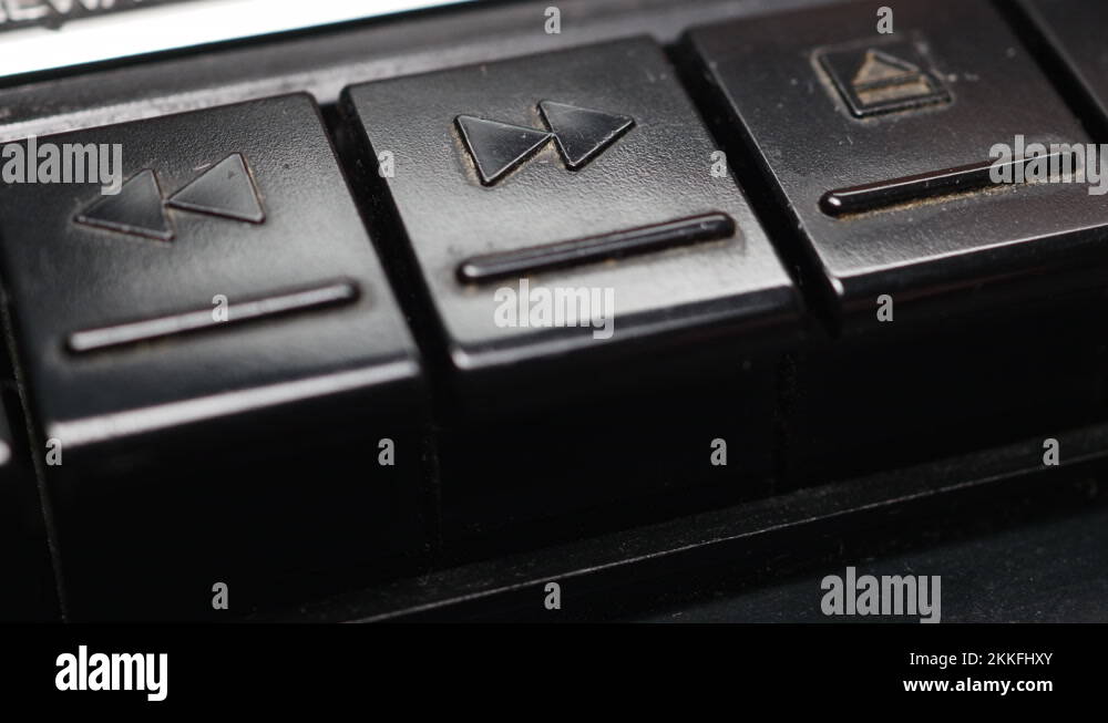 Pressing Fast Forward Button On An Old Black Cassette Tape Recorder
