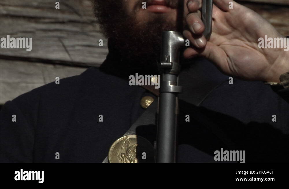 Civil War Union Soldier Reenactor practicing musket drill with