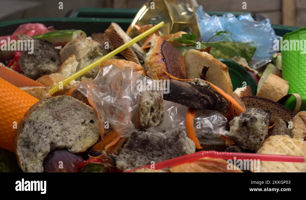 Organic waste, unsold food, uneaten bread, plastic in the trash can Stock Video Footage Alamy