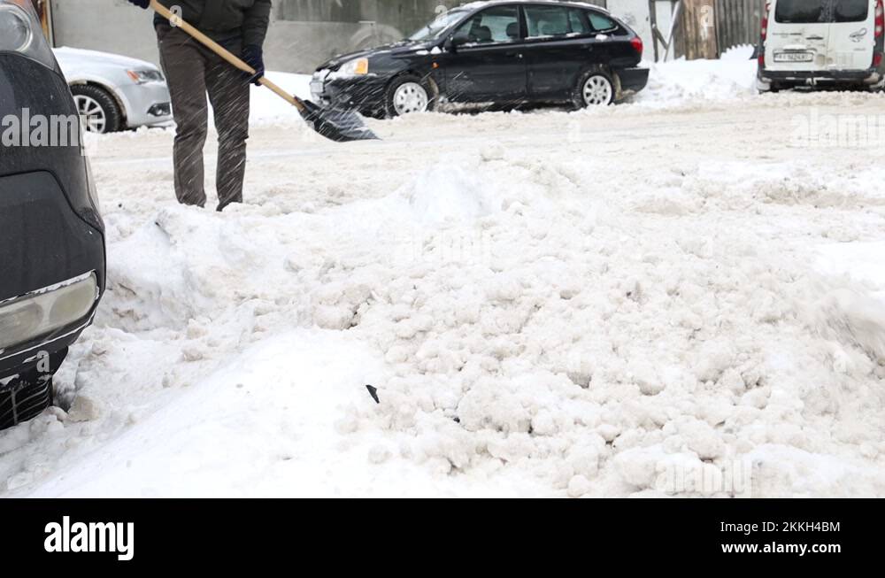 Man With A Snow Shovel Near The Snow Pile Stock Video Footage Alamy