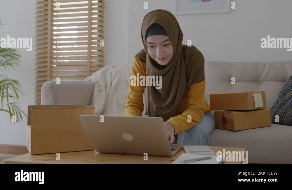 Muslim young women wear hijab using typing and checking order Stock ...