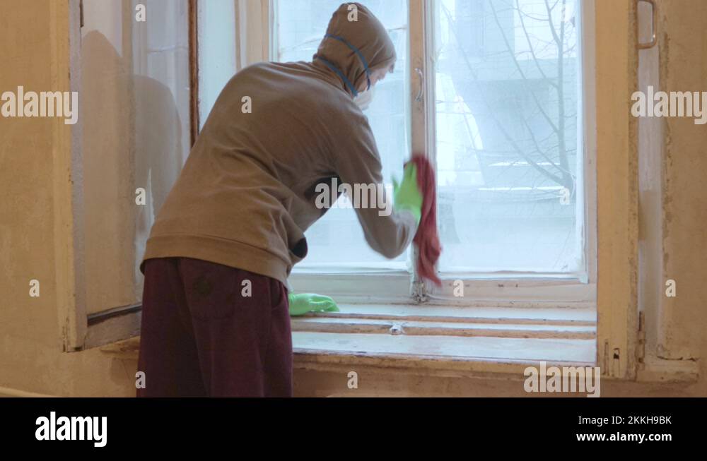 man worker clean window wooden frames in gloves and mask Stock Video ...