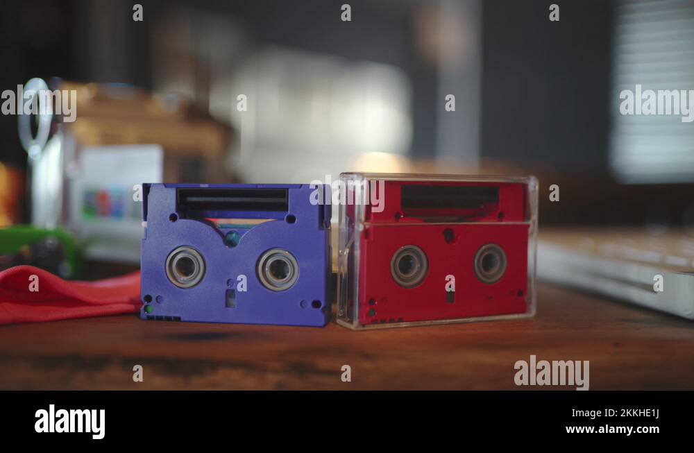 Old videotapes of small size in red and blue from the 90s. VHS Stock