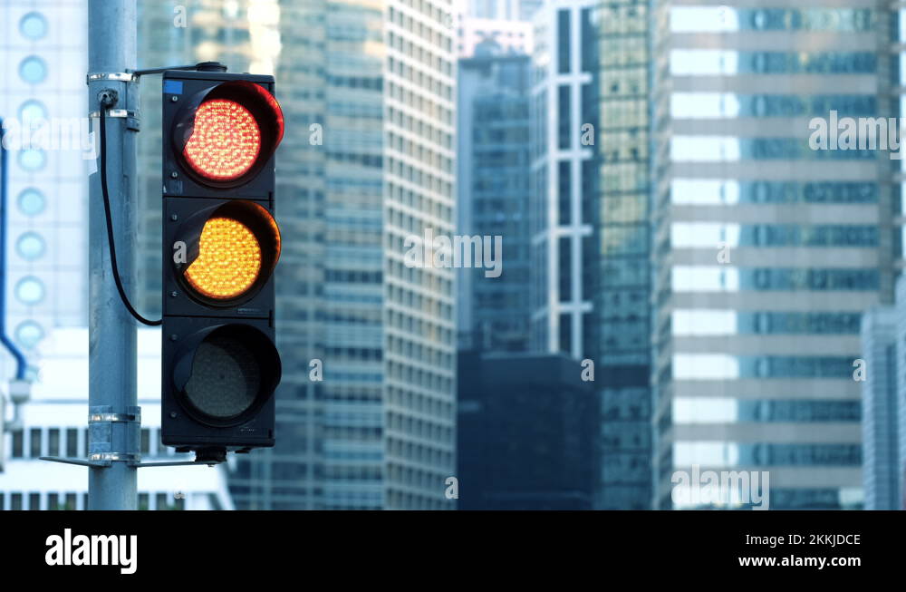 Traffic light turns from red to green at financial district