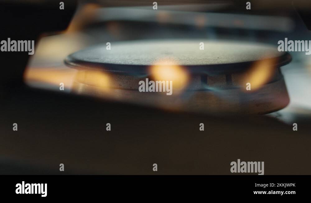 Fireing up a gas stove, close up, blue fire, orange fire. 4K 120fps