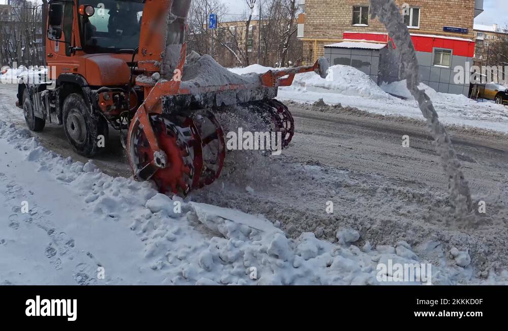The work of snow plows on cleaning and moving snow in urban conditions Stock Video Footage Alamy