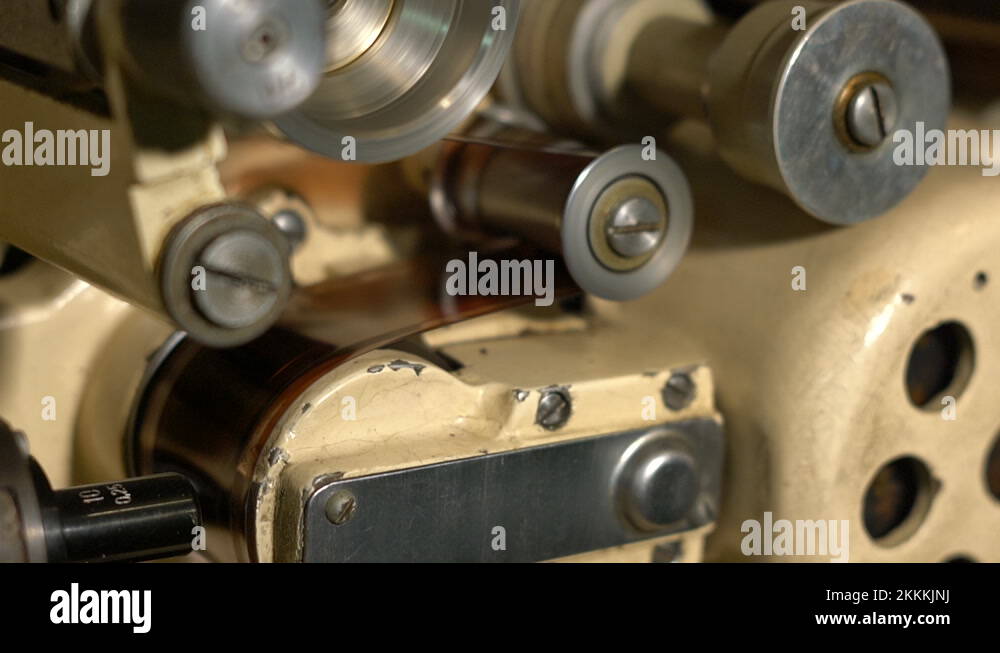 The rollers in the film mechanism rotate rapidly, rewinding the film