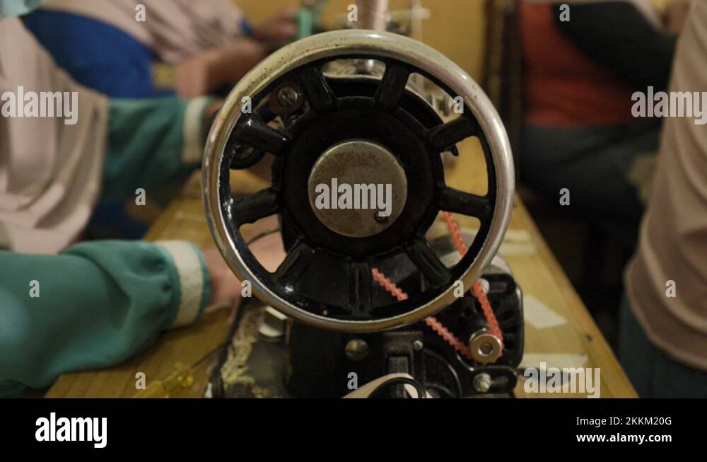 Spinning wheel of a sewing machine while a Spinning wheel of a vintage