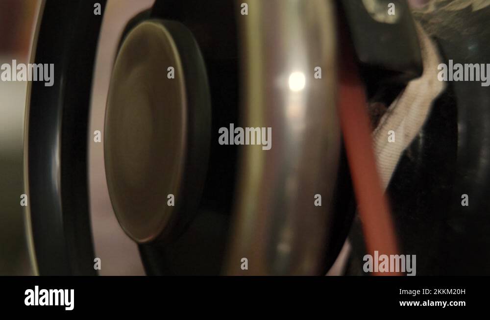 Spinning wheel of a vintage sewing machine to start it's functioning