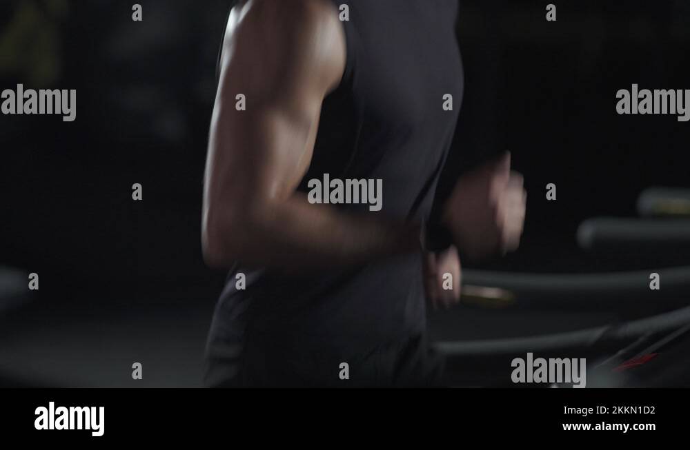 Cinematic Light Anonymous Man Run On A Treadmill Aerobic Exercise cinematic-light-anonymous-man-run-on-a-treadmill-aerobic-exercise