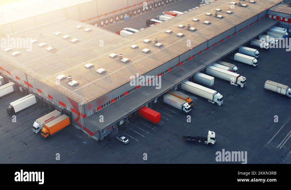 Semitrailers trucks stand at warehouse ramps for load and unload goods