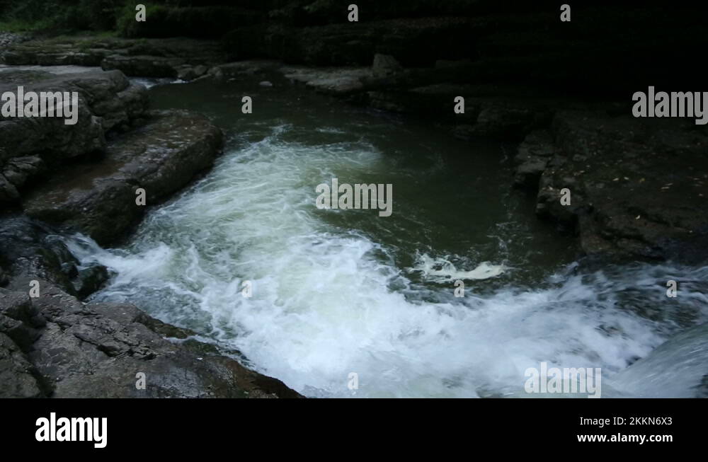 Guy Jumps into River Pool at Waterfall in the forest Stock Video ...