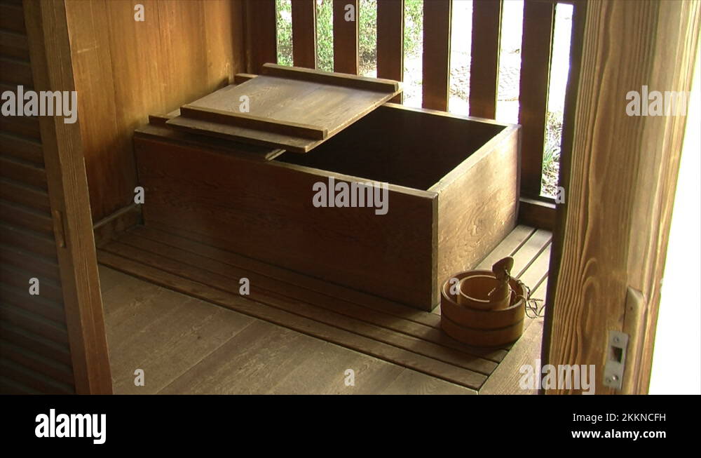 Traditional Japanese soaking tub, or ofuro, in a bathroom Stock Video