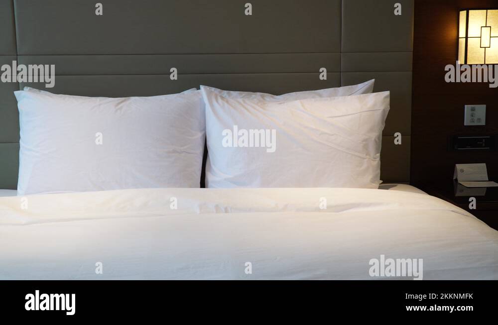 Panning left on clean king size bed in a hotel room in Seoul, South