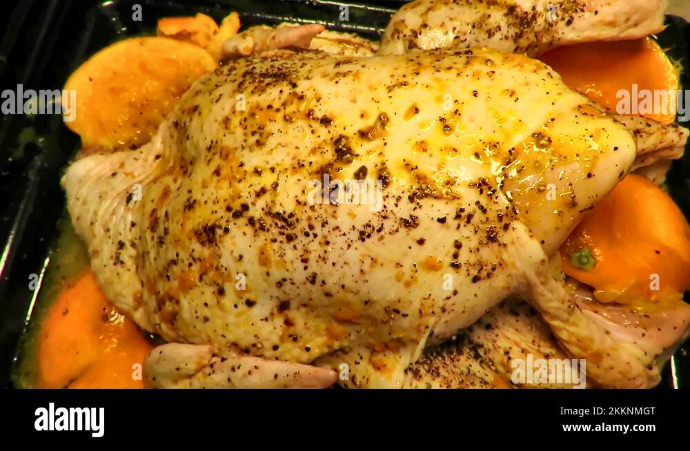 Whole uncooked chicken is marinated with orange juice and skin Stock Video Footage Alamy