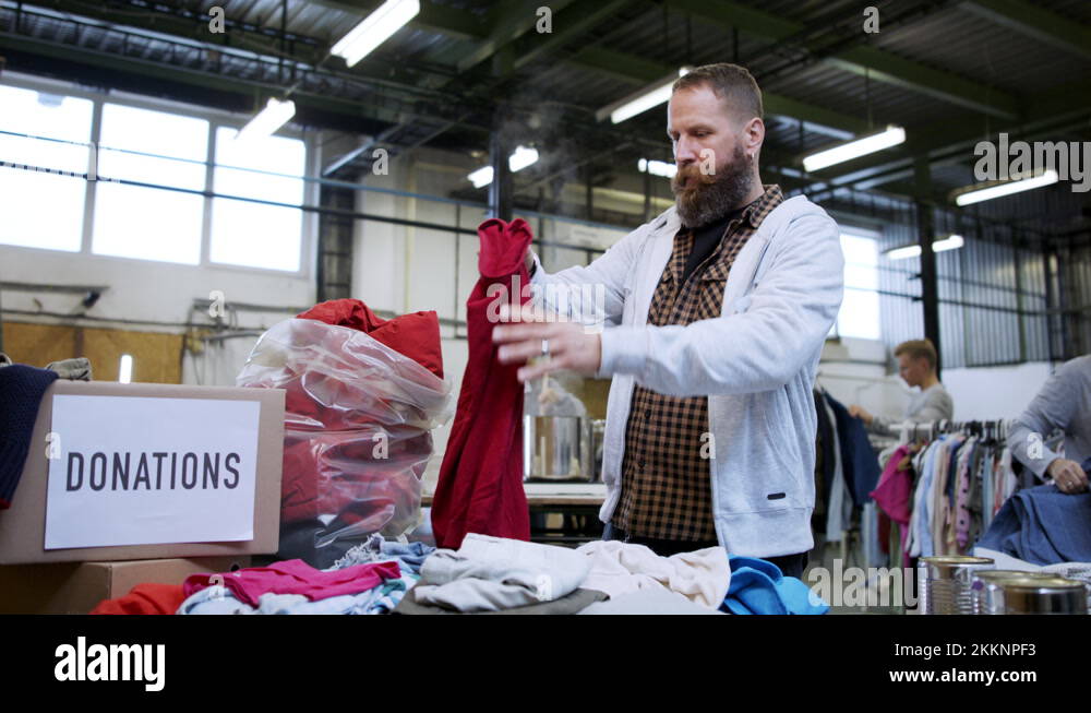Volunteers sorting out donated clothes in community charity donation
