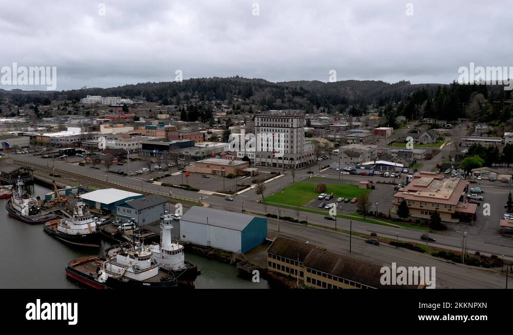 Drone Flying Towards Tioga Apartment Building In Coos Bay Wharf Area In