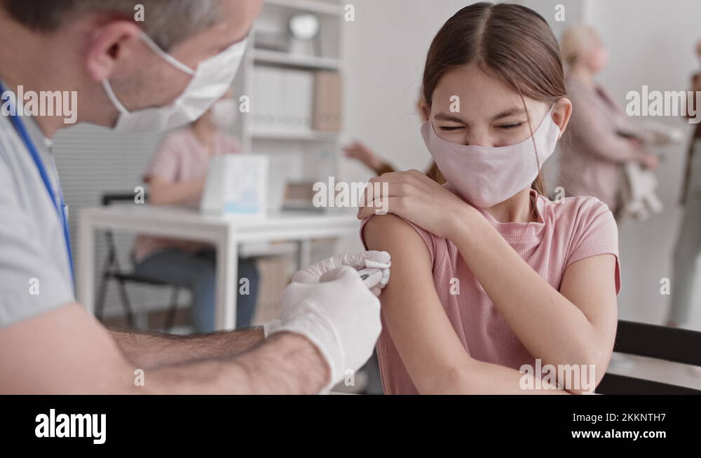 Girl Getting Painful Injection on Shoulder Stock Video Footage Alamy