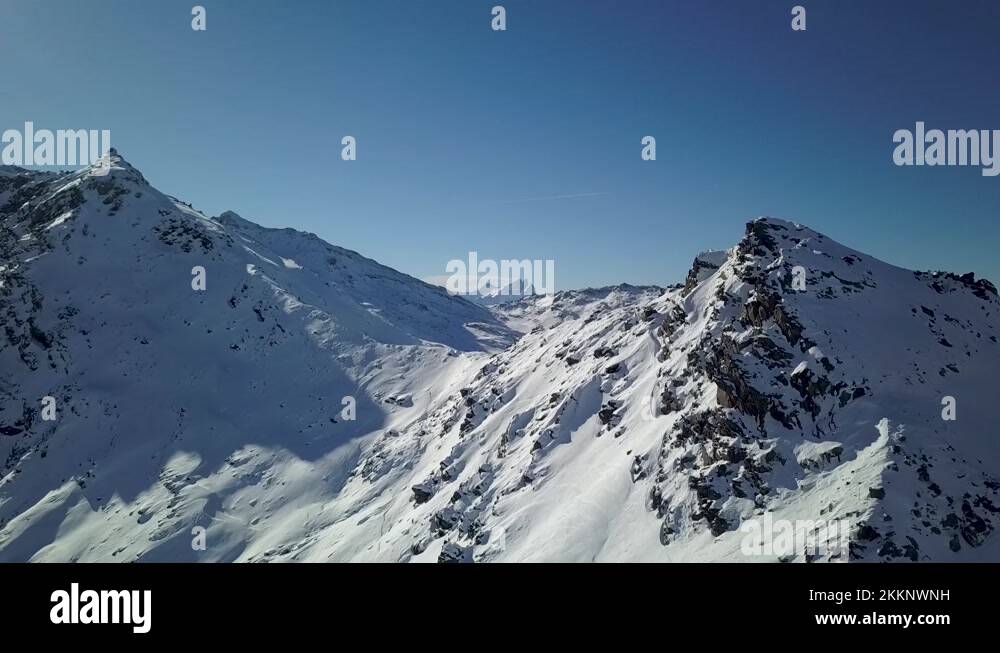 Snowcapped Mighty sharp mountain ridge in Val Thorens summit, French Alps Stock Video Footage