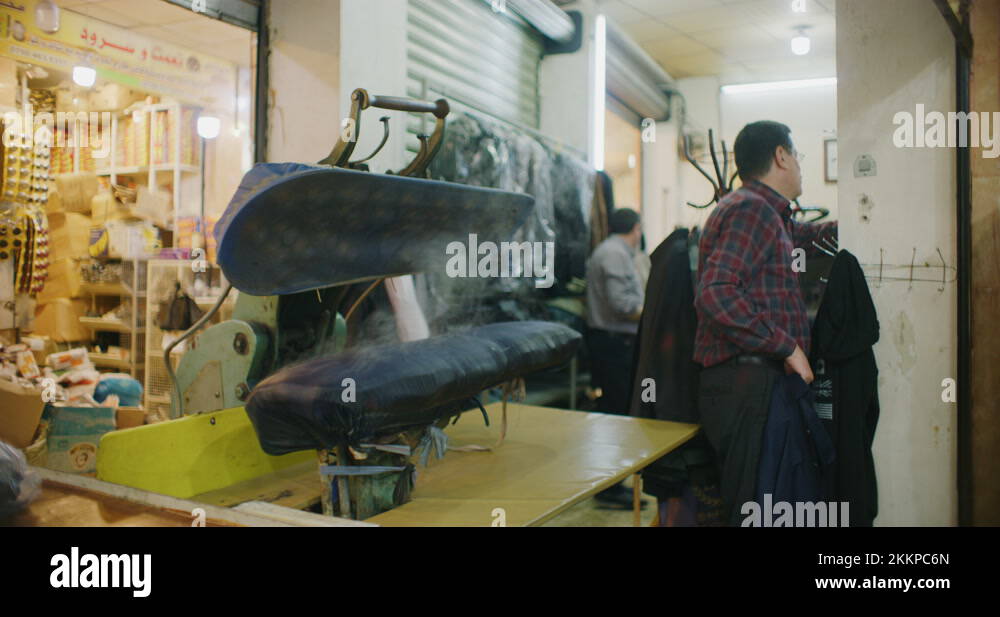 Traditional Steam Press Iron On Suit Jackets At The Grand Bazaar in