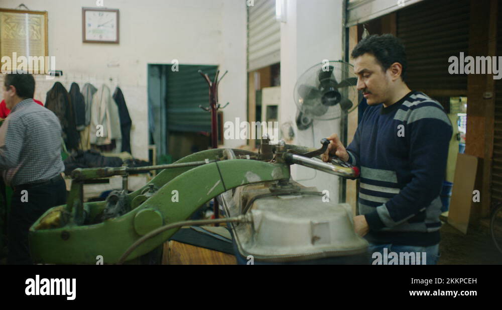 Traditional Steam Press Iron On Suit Jackets At The Grand Bazaar in