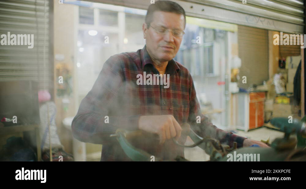 Traditional Steam Press Iron On Suit Jackets At The Grand Bazaar in