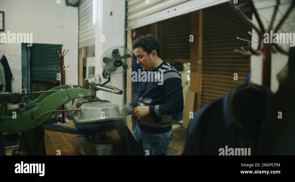 Traditional Steam Press Iron On Suit Jackets At The Grand Bazaar in