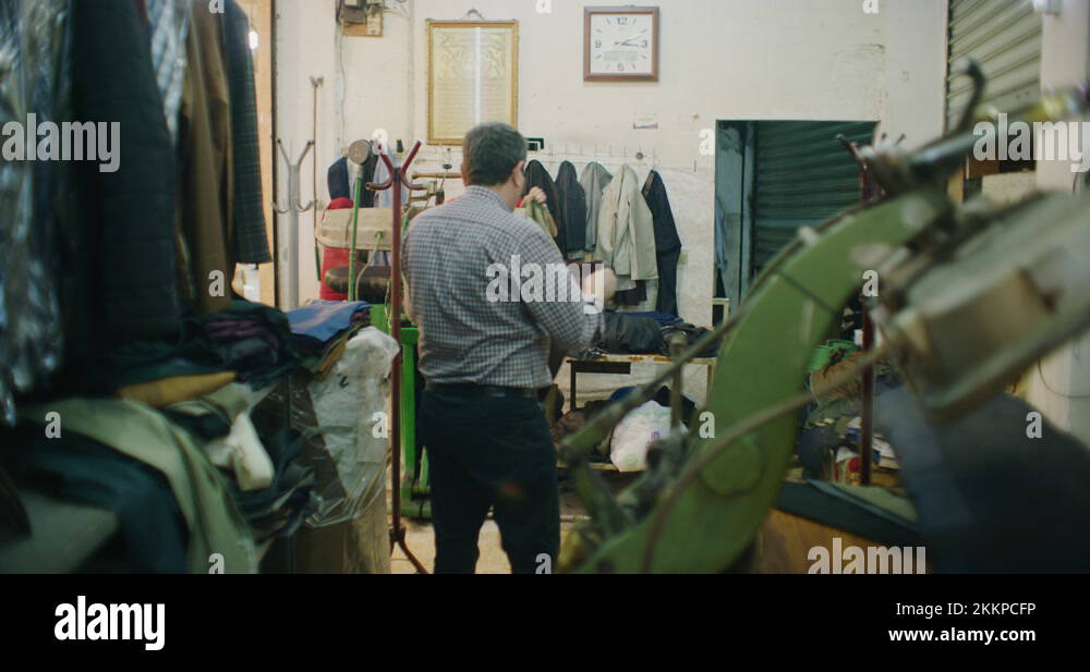 Traditional Steam Press Iron On Suit Jackets At The Grand Bazaar in