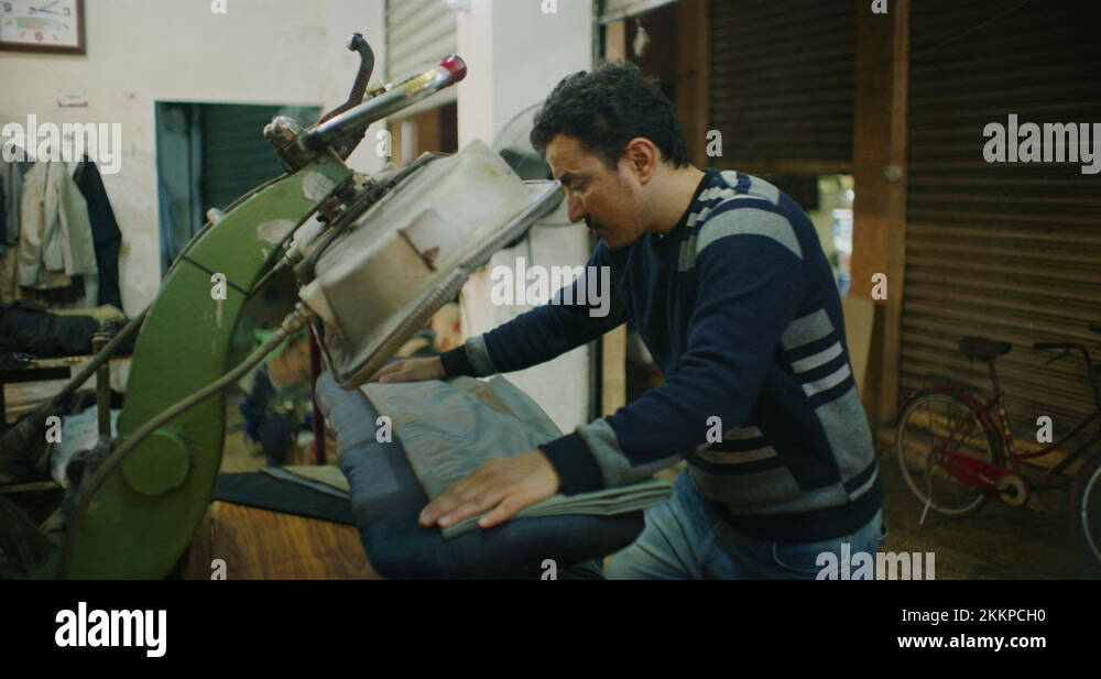 Traditional Steam Press Iron On Suit Jackets At The Grand Bazaar in