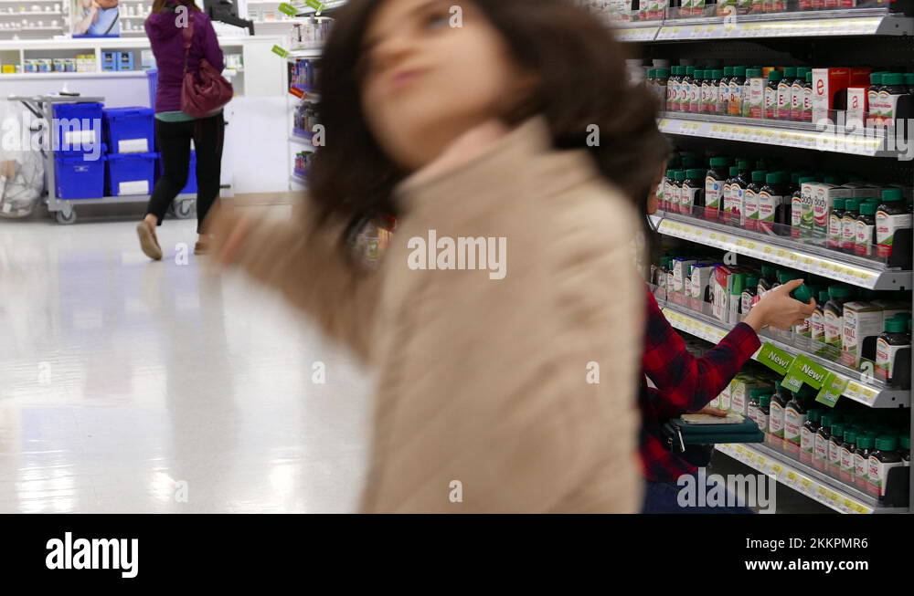 The motion of people buying health food at pharmacy section inside