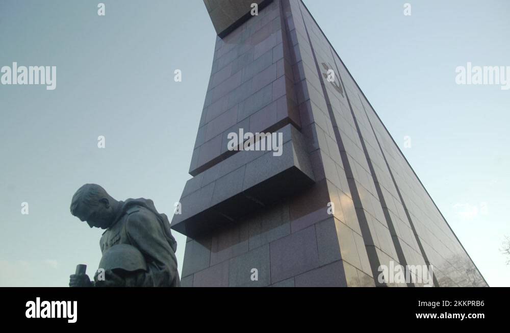Statue of kneeling soldier at Soviet war memorial in Berlin Treptower