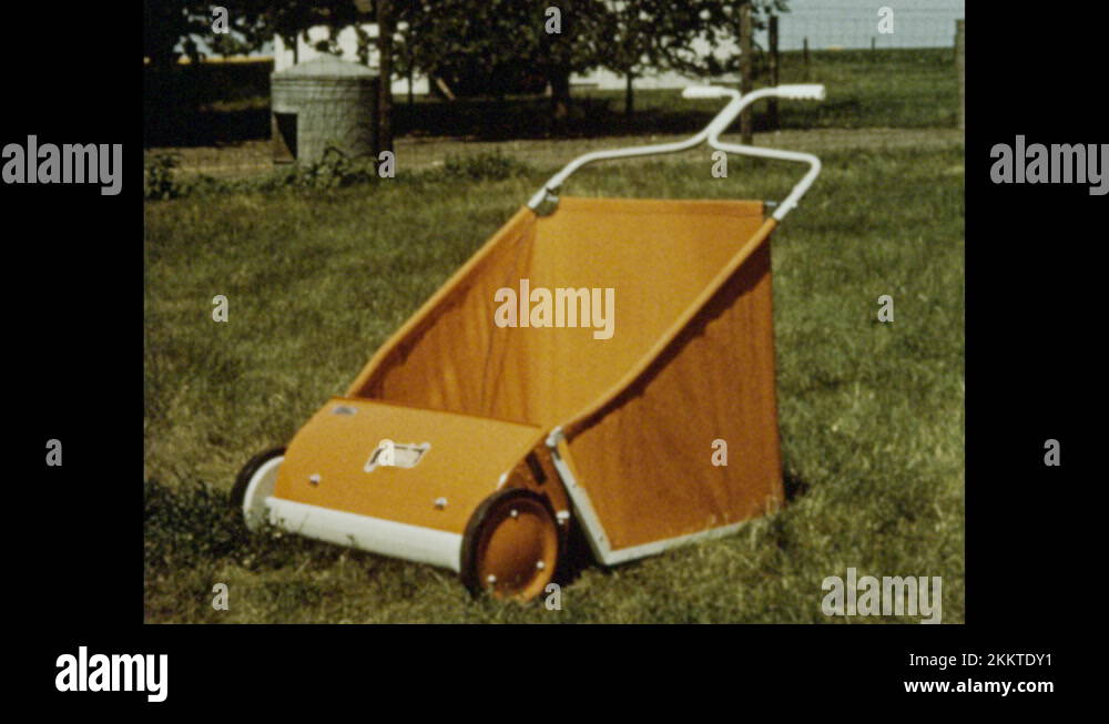1960s Two lawnsweepers, one model is selfpropelled. Man pushes lawn