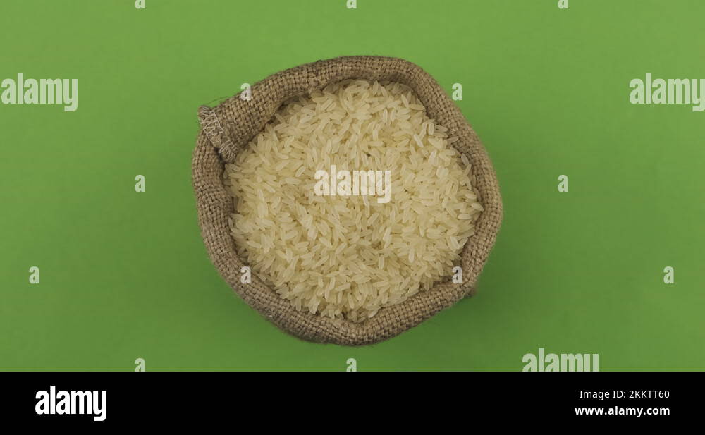 Rotation of a full sack of rice grain. Top view. Isolated Stock Video
