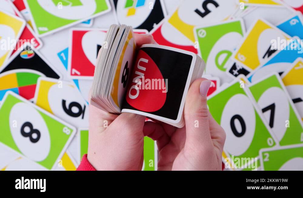 Kiev, Ukraine 9 03 2021. Hands shuffling a deck of playing cards UNO. Static Stock Video